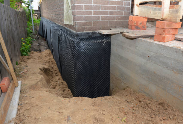 SJ Waterproofing Pros technician performing targeted Waterproofing assessment in Temperance, MI